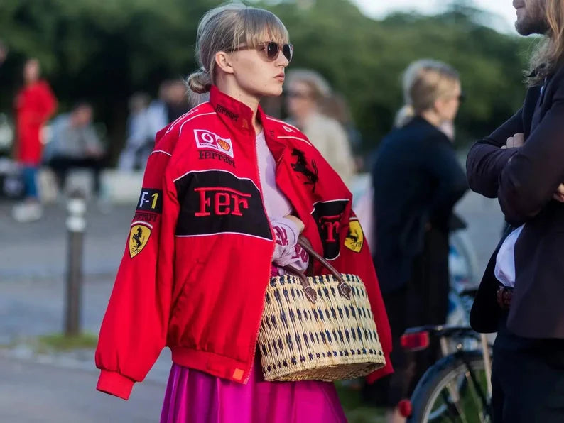 Step into the world of iconic racing fashion with our Ferrari F1 Nascar Retro Cotton Jacket for women. Designed to bring the bold spirit of the 90s to life, this jacket seamlessly blends retro charm with modern-day style. Made from premium cotton, it ensures both comfort and durability. Featuring a stand collar, ribbed cuffs, and a secure zipper closure, this jacket captures the essence of the Ferrari red jacket look while keeping you stylish and cozy. The soft viscose lining adds an extra layer of comfort,